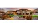 Charming single-story home with a well-manicured lawn, stone accents, and a brick walkway leading to the front door at 911 E Desert Inn Dr, Chandler, AZ 85249