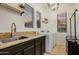 Laundry room equipped with modern appliances, granite countertops, and stylish decor at 911 E Desert Inn Dr, Chandler, AZ 85249