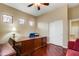 Office space features hardwood floors, ample natural light, and a closet for storage at 911 E Desert Inn Dr, Chandler, AZ 85249