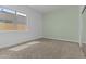 Bright bedroom with carpet, a large window, and a sliding door closet at 9733 W Hedge Hog Pl, Peoria, AZ 85383