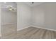 Bedroom featuring hard surface flooring and a doorway into another room at 9733 W Hedge Hog Pl, Peoria, AZ 85383