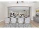 Dining room featuring a large table with seating for eight and an open view to the kitchen and living area at 9733 W Hedge Hog Pl, Peoria, AZ 85383