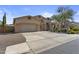 Charming single-Gathering home with a spacious driveway and manicured front yard landscaping at 9733 W Hedge Hog Pl, Peoria, AZ 85383