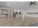 A modern, open kitchen with an island and stainless steel appliances, perfect for cooking and entertaining at 9733 W Hedge Hog Pl, Peoria, AZ 85383
