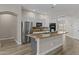 Modern kitchen with stainless steel appliances, island with countertop, and ample storage at 9733 W Hedge Hog Pl, Peoria, AZ 85383