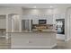 Modern kitchen with stainless steel appliances, island with countertop, and tile backsplash at 9733 W Hedge Hog Pl, Peoria, AZ 85383