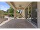 Covered patio with ceiling fan, decorative concrete, and view of the landscaped yard at 9733 W Hedge Hog Pl, Peoria, AZ 85383