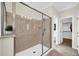 Spa-like bathroom featuring a glass-enclosed shower and neutral color tones at 10749 E Nido Ave, Mesa, AZ 85209