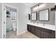 Bathroom featuring dual sinks, modern fixtures, and an elegant design at 10749 E Nido Ave, Mesa, AZ 85209