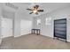 Bright, empty bedroom, complete with a ceiling fan, windows and a closet at 10749 E Nido Ave, Mesa, AZ 85209