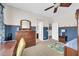Bedroom with blue accent wall, dresser, and ceiling fan at 10749 E Nido Ave, Mesa, AZ 85209