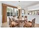 Dining area with decorative oval table, unique chairs and chandelier at 10749 E Nido Ave, Mesa, AZ 85209