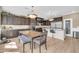 Open kitchen with dark wood cabinets and a large island and breakfast bar at 10749 E Nido Ave, Mesa, AZ 85209