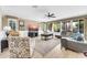 Spacious living room with neutral colors, large windows and comfortable seating at 10749 E Nido Ave, Mesa, AZ 85209
