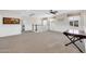 Well-lit open loft featuring a railing overlooking the downstairs, recessed lights, and neutral color palette at 10749 E Nido Ave, Mesa, AZ 85209