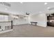 Bright loft area with a ceiling fan, lots of sunlight, and nice custom built-ins at 10749 E Nido Ave, Mesa, AZ 85209