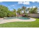 Inviting backyard oasis with a private pool, waterfall feature, lush landscaping, and ample space at 10749 E Nido Ave, Mesa, AZ 85209
