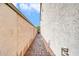The side yard features a walkway that leads to the back of the property at 10749 E Nido Ave, Mesa, AZ 85209