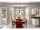 Cozy dining area with large windows and a backyard view at 3713 E Encinas Ave, Gilbert, AZ 85234
