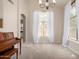 Bright dining room with natural light, neutral walls, plush carpet, and elegant chandelier at 3713 E Encinas Ave, Gilbert, AZ 85234