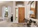 Open entryway with neutral walls, tile flooring, ample light, and a stylish console table at 3713 E Encinas Ave, Gilbert, AZ 85234