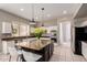 Spacious kitchen with granite countertops, a kitchen island, and stainless steel appliances at 3713 E Encinas Ave, Gilbert, AZ 85234
