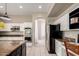 Modern kitchen with stainless steel appliances and granite countertops at 3713 E Encinas Ave, Gilbert, AZ 85234