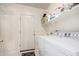 Well-organized laundry room featuring a washing machine and dryer, plus ample shelving for storage at 3713 E Encinas Ave, Gilbert, AZ 85234