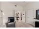 Cozy living room area with a recliner, bookcase and doorway leading to other rooms at 3713 E Encinas Ave, Gilbert, AZ 85234
