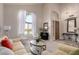 Inviting living room boasts lots of natural light, plush carpet, and stylish decor at 3713 E Encinas Ave, Gilbert, AZ 85234