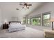 Light and airy main bedroom with large windows and neutral color palette at 3713 E Encinas Ave, Gilbert, AZ 85234