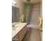 The bathroom features a vanity with a sink, a mirror, a toilet, and a bathtub with a shower at 5322 N 78Th St, Scottsdale, AZ 85250
