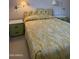Cozy bedroom features matching green and yellow patterned bed set and two side tables with drawer storage at 5322 N 78Th St, Scottsdale, AZ 85250