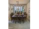 Elegant dining room with a chandelier and views of foliage at 5322 N 78Th St, Scottsdale, AZ 85250