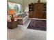 Living room featuring a sofa, built-in shelves, a rug, and carpeted floors at 5322 N 78Th St, Scottsdale, AZ 85250
