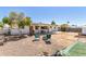Cozy backyard features gravel landscaping, patio, citrus tree and sitting area at 5410 E Duncan St, Mesa, AZ 85205