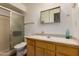 Simple bathroom featuring a shower, toilet, and vanity with mirror at 5410 E Duncan St, Mesa, AZ 85205