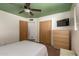 Bright bedroom with closet, ceiling fan, and natural light at 5410 E Duncan St, Mesa, AZ 85205
