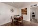 Cozy dining area with a round table, seating for four, and a built-in display shelf at 5410 E Duncan St, Mesa, AZ 85205