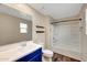 Bright bathroom features a double sink vanity, shower over bath, and sleek finishes at 129 S 198Th Dr, Buckeye, AZ 85326