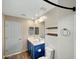 Stylish bathroom features a double sink vanity and shower over bath at 129 S 198Th Dr, Buckeye, AZ 85326