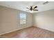 Empty bedroom featuring hard flooring and a window at 129 S 198Th Dr, Buckeye, AZ 85326