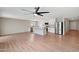 Open-concept kitchen flows to the living room and features stainless steel appliances and an island at 129 S 198Th Dr, Buckeye, AZ 85326
