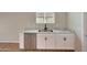Kitchenette area with stainless steel dishwasher, and marble countertops at 129 S 198Th Dr, Buckeye, AZ 85326