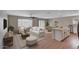 Spacious living room featuring a kitchen island, cozy sitting area and dining area with plenty of light at 129 S 198Th Dr, Buckeye, AZ 85326