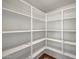 Walk-in pantry with shelving and wood flooring at 129 S 198Th Dr, Buckeye, AZ 85326