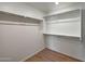Spacious walk-in closet featuring built-in shelving and rod for ample storage at 129 S 198Th Dr, Buckeye, AZ 85326
