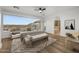 Serene main bedroom with a large window view, stylish seating, and an ensuite bathroom with a soaking tub at 36 W Foothill Dr, Phoenix, AZ 85021