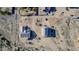 Aerial view of two homes under construction with roof tile, wrap, and vacant lots at 3835 W Fox Rd, Laveen, AZ 85339