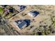 Aerial view of homes under construction in an expansive desert landscape at 3835 W Fox Rd, Laveen, AZ 85339